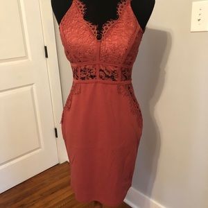 Iris rust colored semi formal dress with lace detail.